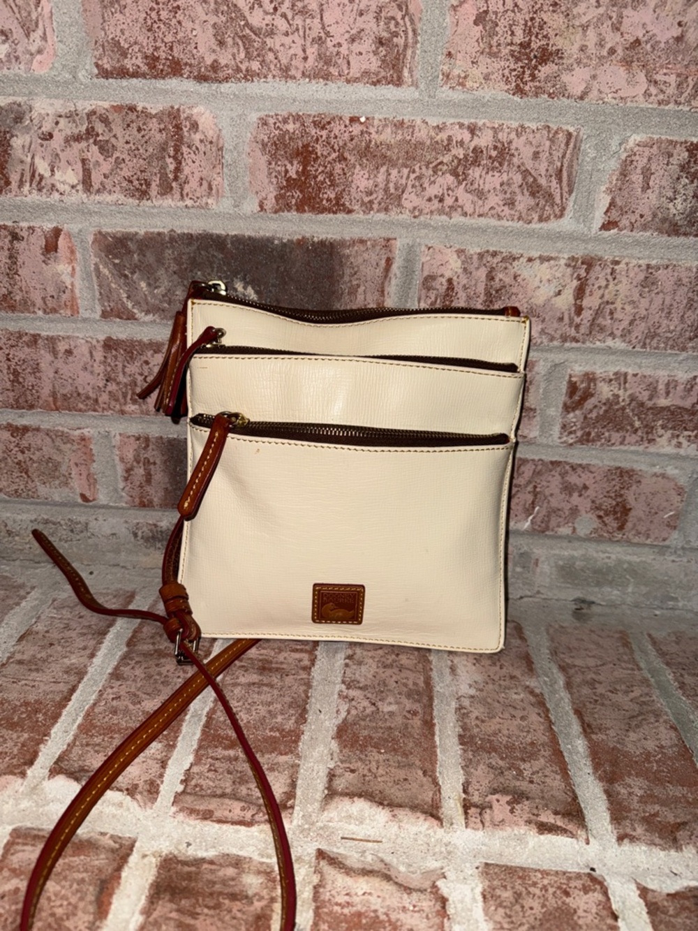 Dooney & Bourke triple zipper Cream Crossbody with Brown Leather Trim how
